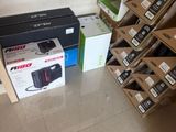 many boxes of electronic equipment on the floor