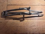 a pair of pliers sitting on a wooden table
