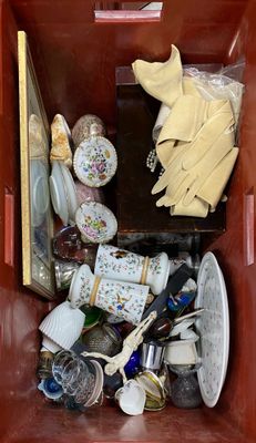 a red box filled with assorted items in it