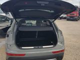 the back end of a car with its trunk open in a parking lot