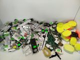 a pile of assorted items on the floor next to a wall