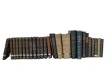 a group of books sitting on top of each other on a shelf