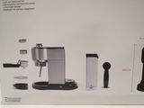 packaging of a coffee machine with a coffee cup and a coffee grinder