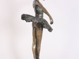 bronze statue of a young ballerina on a wooden base