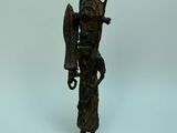 bronze statue of a man with a bird on his shoulder
