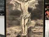 tableau représentant Jésus sur la croix, exposé dans un magasin