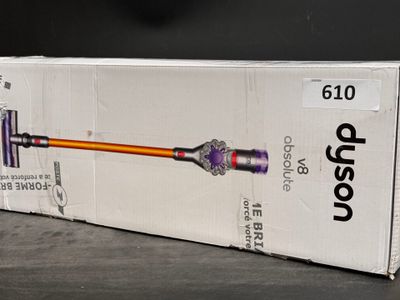 boxed box of a cordless vacuum cleaner sitting on top of a table