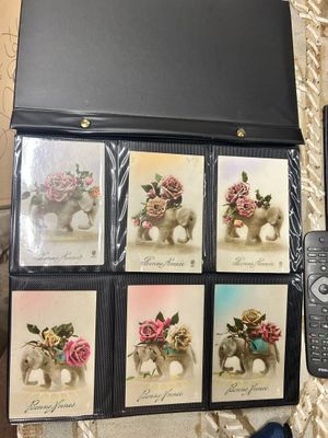 a box of cards with pictures of elephants and a remote control