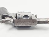 an old gun that is sitting on a white surface