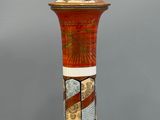 a vase with a decorative design on it on a table