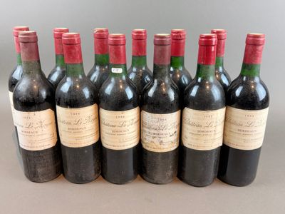 six bottles of wine are lined up in a row on a table