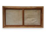 an old wooden window with a glass pane on the outside