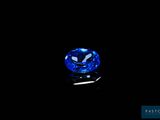 a blue sapphire stone on a black background