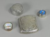 several silver objects are sitting on a table with a white background
