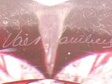 a close up of a heart shaped object with writing on it