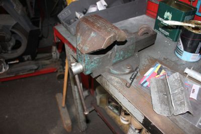 a workbench with tools on it in a garage