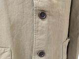 the back of a man ' s jacket with buttons on it