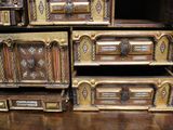 many wooden boxes stacked on top of each other on a table