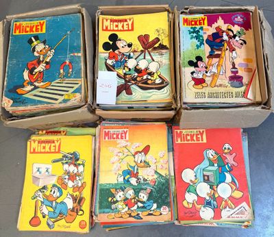 several mickey mouse books are stacked on top of each other