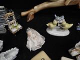 many figurines on a black table with a phone