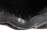 a close up of a black hat with a button on it