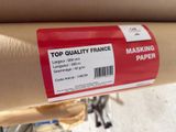 a close up of a roll of paper on a bicycle