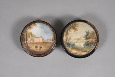 pair of miniature paintings of a house and a park on a table