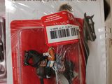 a toy horse that is in a package on the shelf