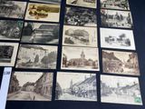 many old postcards that are on display on the table
