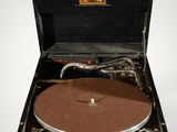 an old record player in a suitcase on a white surface