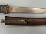 two knives that are sitting next to each other on a table