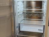 an open refrigerator that is sitting in a kitchen