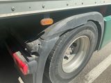 a close up of a flat tire on a truck