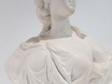 marble bust of a woman on a pedestal on a white background