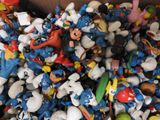 a box full of toy figurines of various characters