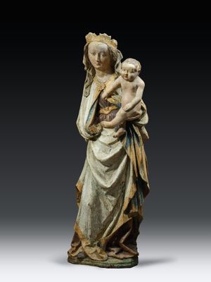 a statue of a woman holding a child in her arms