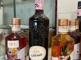 several bottles of alcohol are lined up on a counter