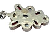silver plated pendant with red and blue stones on a silver chain