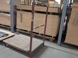 several pallets of wood are stacked on pallets in a warehouse