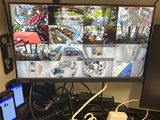 a desk with two monitors and a laptop on it