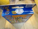 a box with a stuffed animal inside of it on a table