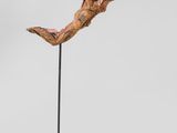 an image of a sculpture of a person jumping in the air