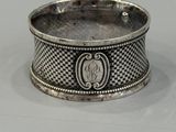 a close up of a silver ring with a snake on it