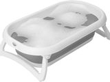 a bathtub with two balls in it on a stand