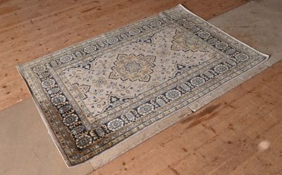 a rug on the floor in the middle of the room