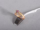 a picture of a gold ring with a pink stone