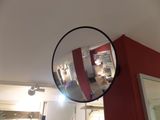 a mirror that is hanging on the wall in the room