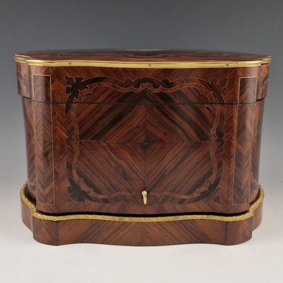 an image of a wooden box with a decorative design on the front