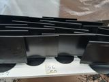 several computer monitors are lined up on a table with a price tag