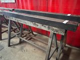 a large piece of metal sitting on top of a table